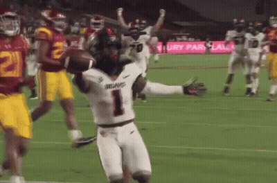 A Football Player With The Number 1 On His Jersey Is Running With A Ball GIF