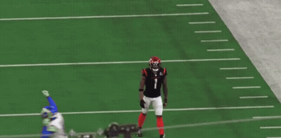 A Football Player With The Number 1 On His Jersey Is Walking On The Field GIF
