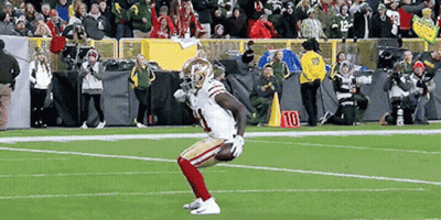 A Football Player With The Number 10 On His Jersey Is On The Field GIF