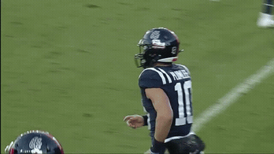 A Football Player With The Number 10 On His Jersey Is Running On The Field GIF