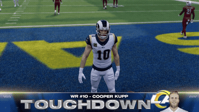 A Football Player With The Number 10 On His Jersey Is Standing On The Field GIF
