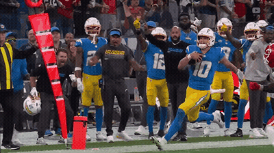 A Football Player With The Number 10 On His Jersey Runs On The Field GIF