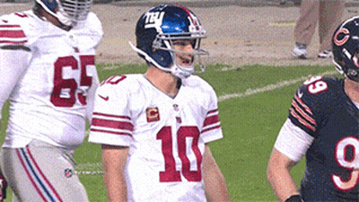 A Football Player With The Number 10 On His Jersey Stands On The Field GIF