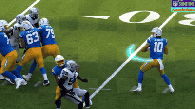 A Football Player With The Number 10 On His Jersey Throws A Pass GIF