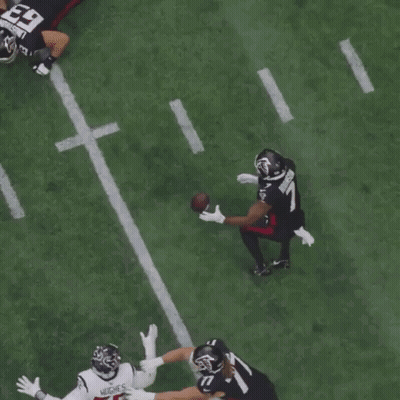 A Football Player With The Number 11 On His Jersey Catches The Ball GIF