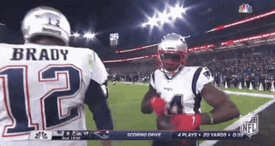 A Football Player With The Number 12 On His Back GIF