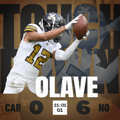 A Football Player With The Number 12 On His Jersey Catching A Ball GIF