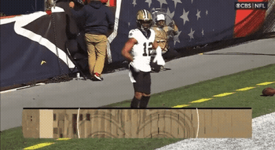 A Football Player With The Number 12 On His Jersey Is Running On The Field GIF