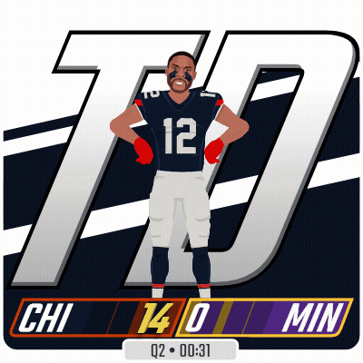 A Football Player With The Number 12 On His Jersey Is Standing With His Hands On His Hips GIF