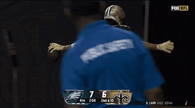 A Football Player With The Number 12 On The Back Of His Shirt GIF