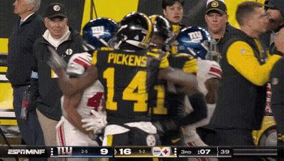 A Football Player With The Number 14 On His Back GIF