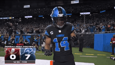 A Football Player With The Number 14 On His Jersey Stands On The Field GIF