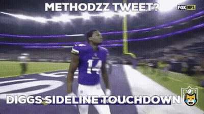 A Football Player With The Number 14 On His Jersey Stands On The Field . GIF
