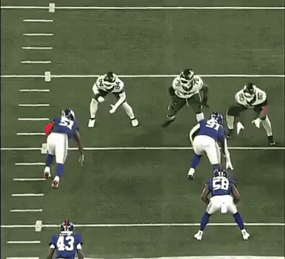 A Football Player With The Number 15 On His Jersey Is Being Tackled By Another Player . GIF