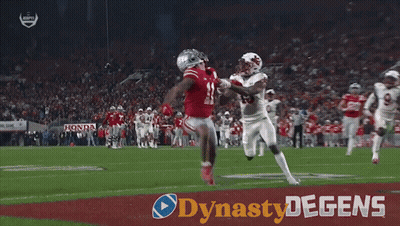 A Football Player With The Number 15 On His Jersey Is Being Tackled By Another Player On The Field GIF