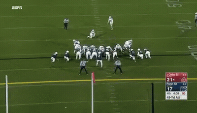 A Football Player With The Number 15 On His Jersey Is Running On The Field GIF