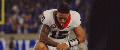 A Football Player With The Number 15 On His Jersey Is Smoking A Cigarette GIF