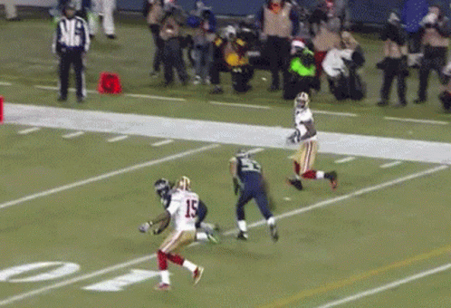 A Football Player With The Number 15 On His Jersey Runs On The Field GIF