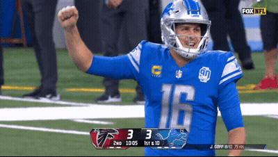 A Football Player With The Number 16 On His Jersey Celebrates On The Field GIF