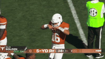 A Football Player With The Number 16 On His Jersey Stands On A Field GIF