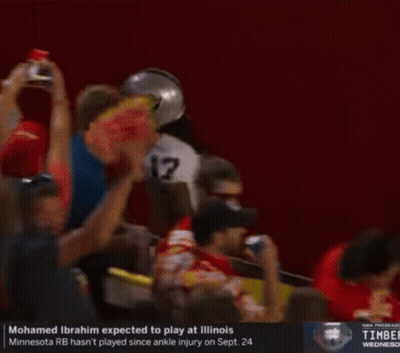 A Football Player With The Number 17 On His Jersey Is Being Helped Off The Field GIF