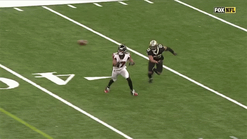 A Football Player With The Number 17 On His Jersey Is Playing On The Field GIF