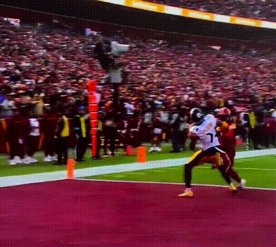 A Football Player With The Number 17 On His Jersey Is Running With The Ball GIF