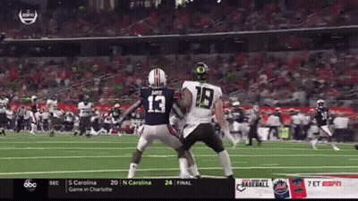 A Football Player With The Number 18 On His Back GIF