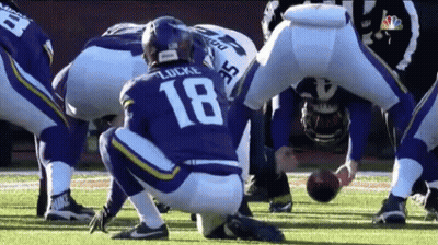 A Football Player With The Number 18 On His Jersey Is Kneeling Down GIF
