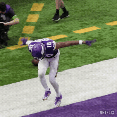 A Football Player With The Number 18 On His Jersey Is Running On The Field GIF