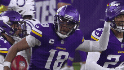 A Football Player With The Number 18 On His Jersey Is Running With The Ball GIF
