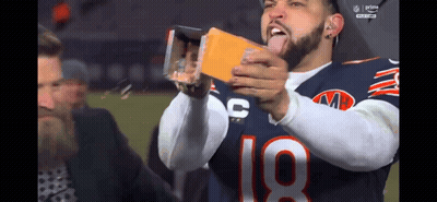 A Football Player With The Number 18 On His Jersey Is Taking A Picture Of Himself GIF