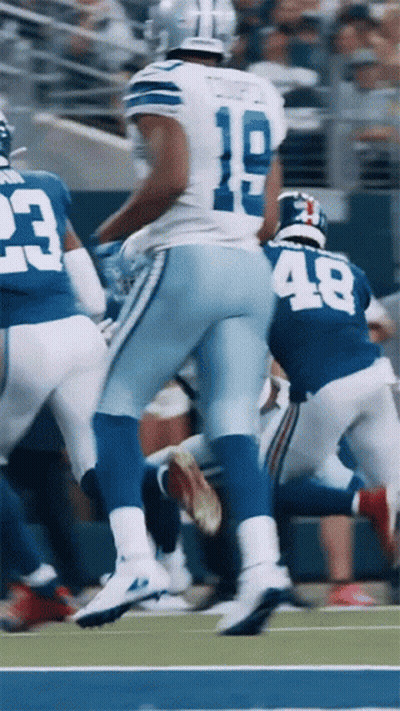 A Football Player With The Number 18 On His Jersey Runs On The Field GIF
