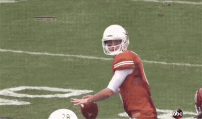 A Football Player With The Number 19 On His Jersey Is Being Tackled GIF