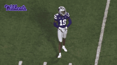 A Football Player With The Number 19 On His Jersey Is Jumping In The Air GIF