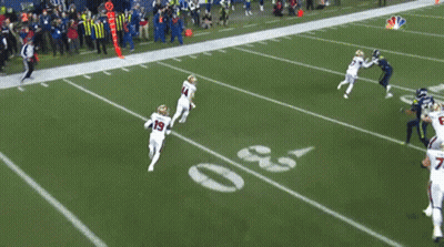 A Football Player With The Number 19 On His Jersey Runs On The Field GIF