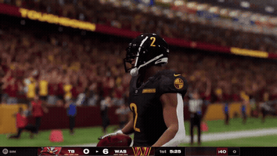 A Football Player With The Number 2 On His Helmet Stands On The Field GIF