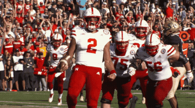A Football Player With The Number 2 On His Jersey Is Running On The Field GIF