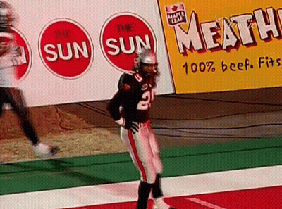 A Football Player With The Number 2 On His Jersey Is Standing On The Field GIF