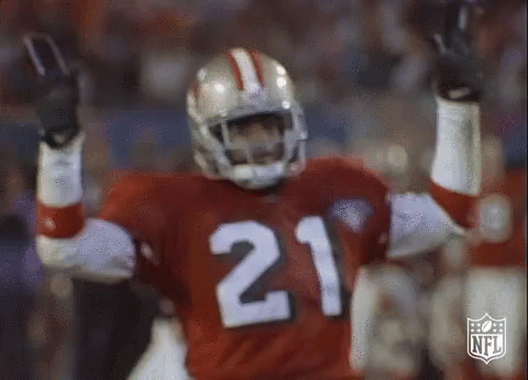 A Football Player With The Number 21 On His Jersey Is Celebrating GIF