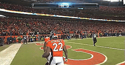 A Football Player With The Number 22 On His Jersey Runs On The Field GIF