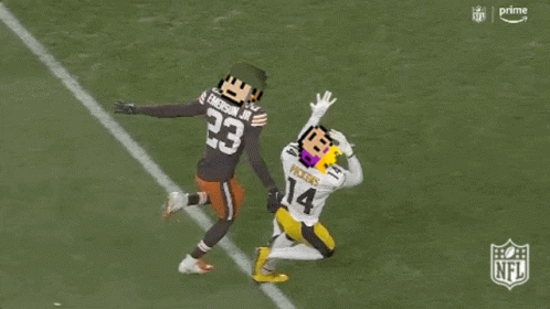 A Football Player With The Number 23 On His Jersey Is Being Tackled By Another Player GIF