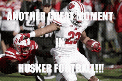 A Football Player With The Number 23 On His Jersey Runs With The Ball GIF