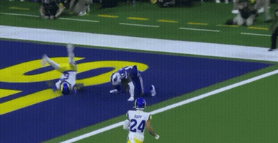 A Football Player With The Number 24 On His Back Is Running On The Field GIF