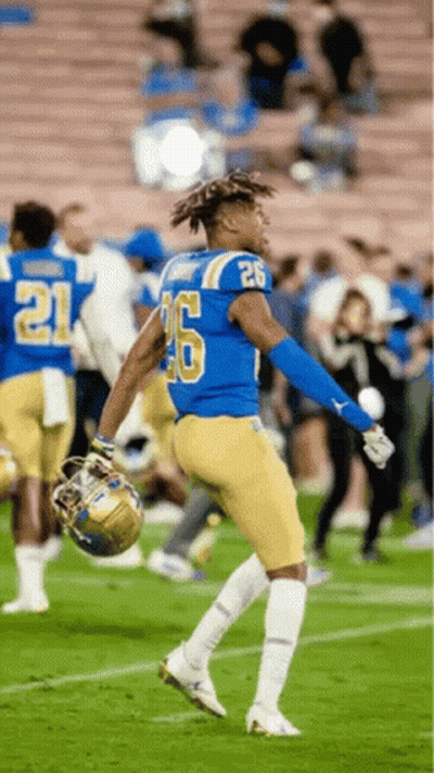 A Football Player With The Number 26 On His Shirt GIF