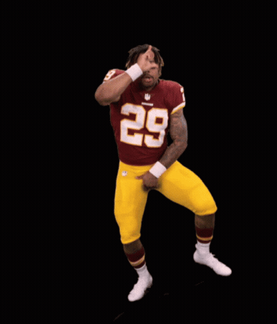 A Football Player With The Number 28 On His Jersey Is Dancing GIF