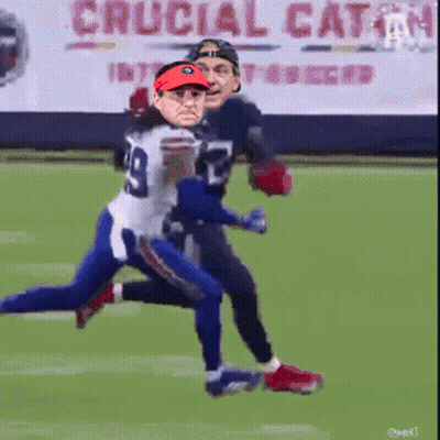 A Football Player With The Number 29 On His Jersey Is Being Tackled GIF
