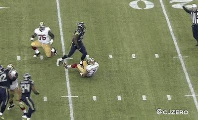 A Football Player With The Number 29 On His Jersey Stands On The Field GIF