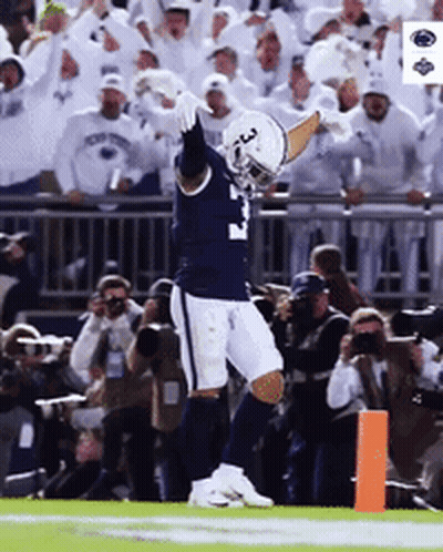 A Football Player With The Number 3 On His Jersey Celebrates On The Field GIF