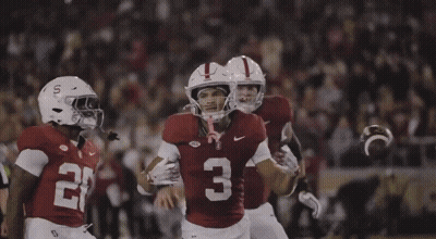A Football Player With The Number 3 On His Jersey Is Being Hugged By Another Player GIF